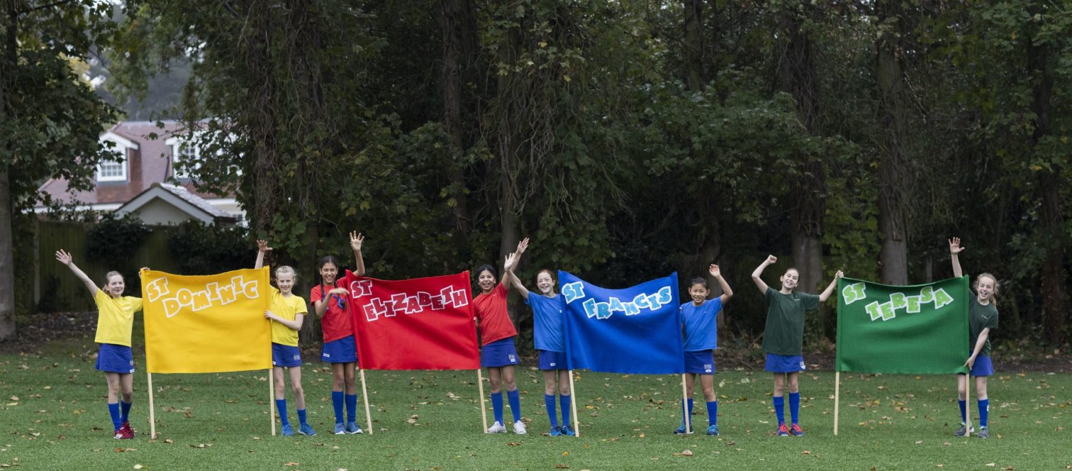 girls with banners in their hands in different colours