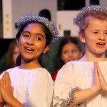 children dressed as angels in school nativity