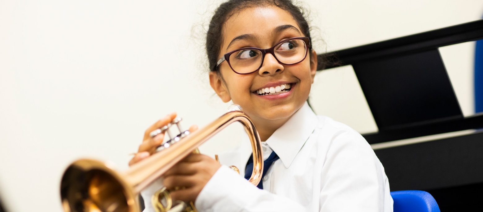 child playing a trumpet