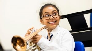 child playing a trumpet