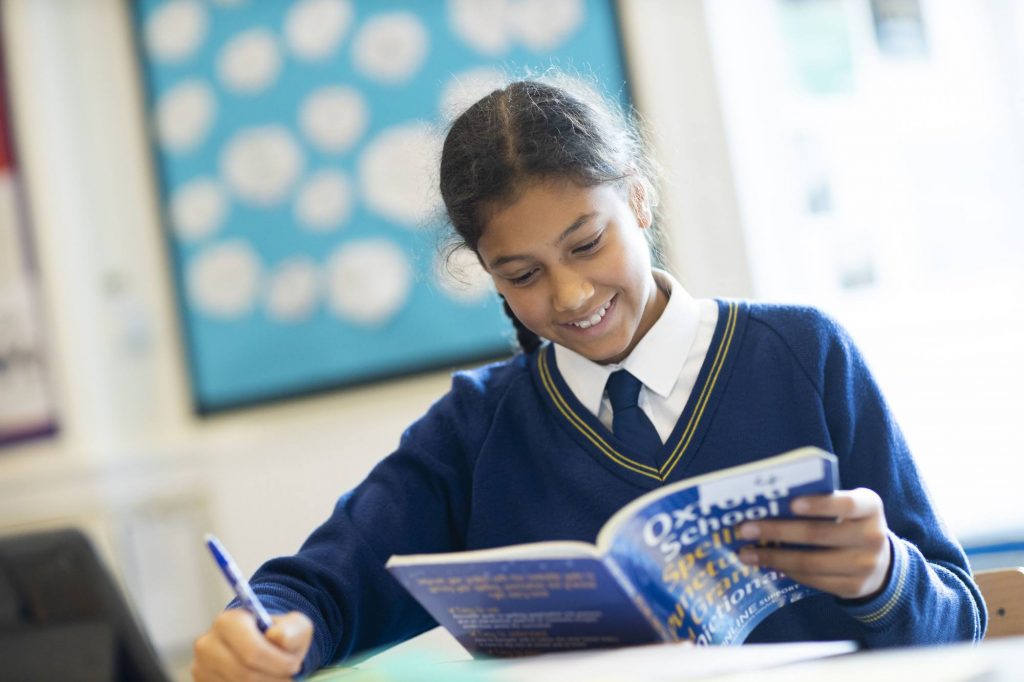 student reading a dictionary