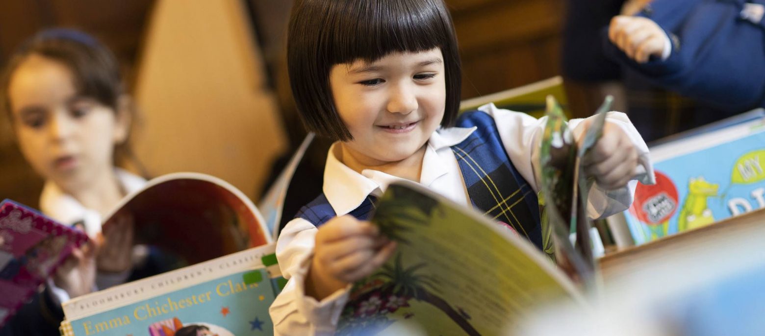 school girls reading in the library