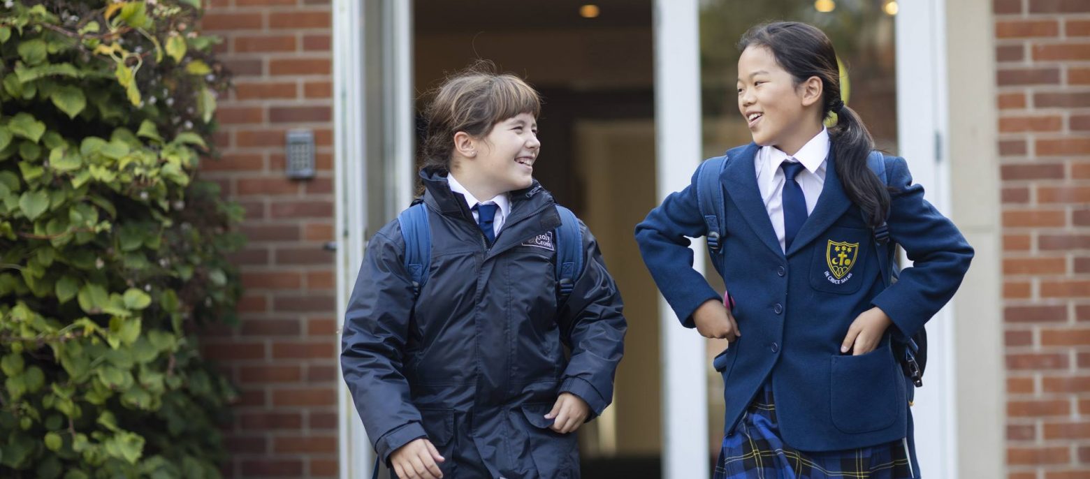 2 students leaving the school