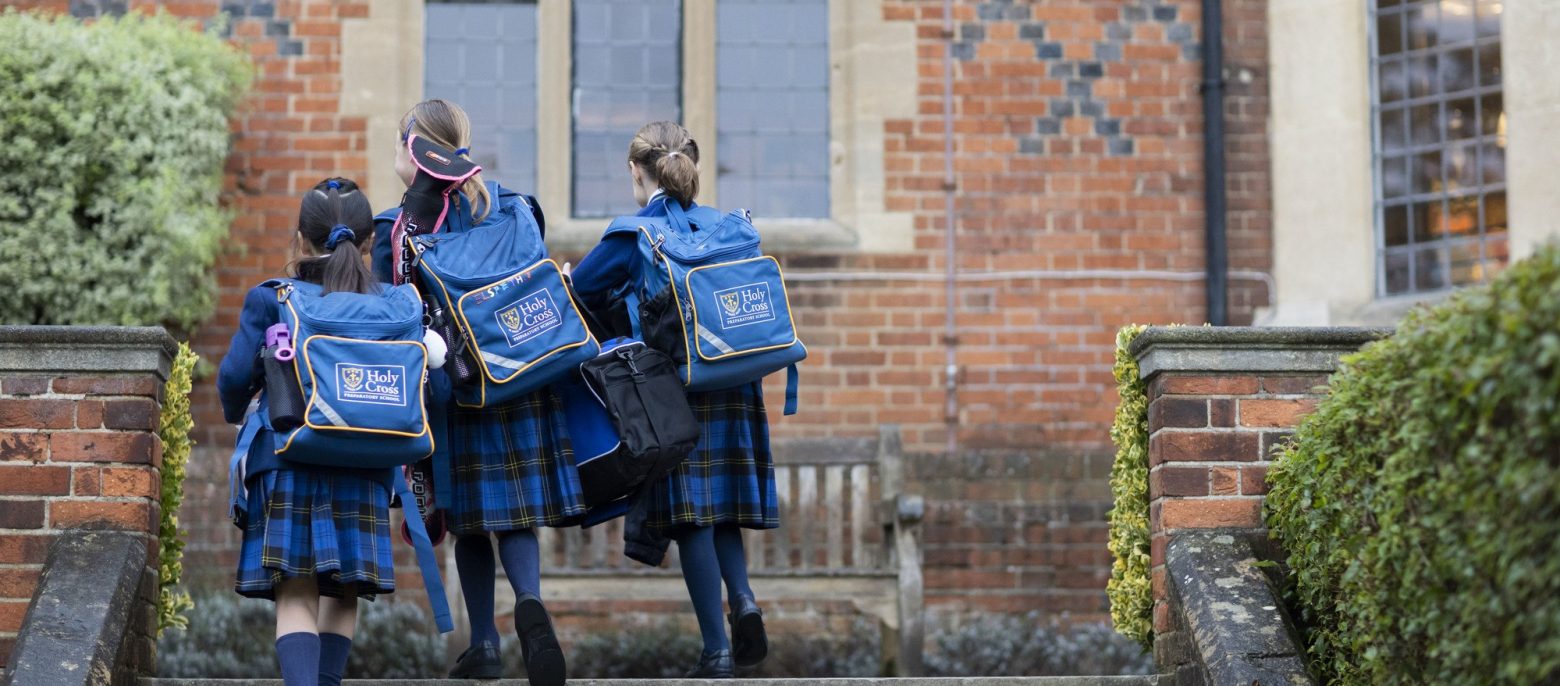 students walking up the stairs to class