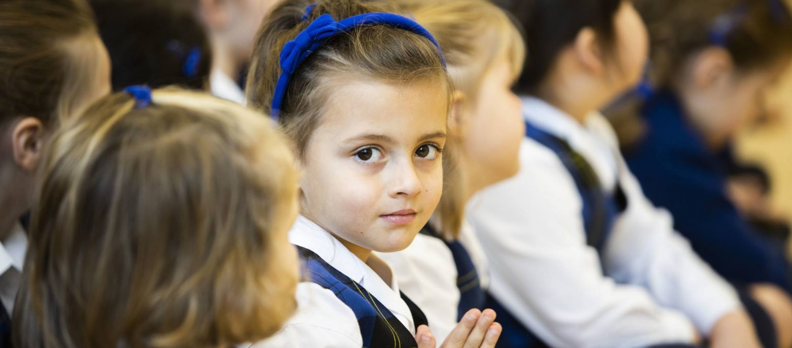 child with hands together