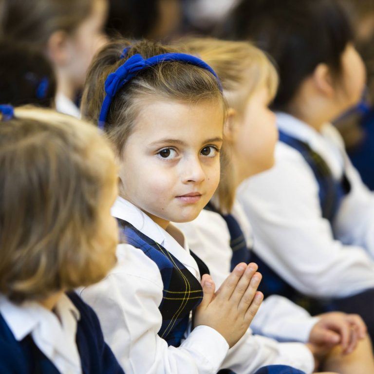 child with hands together