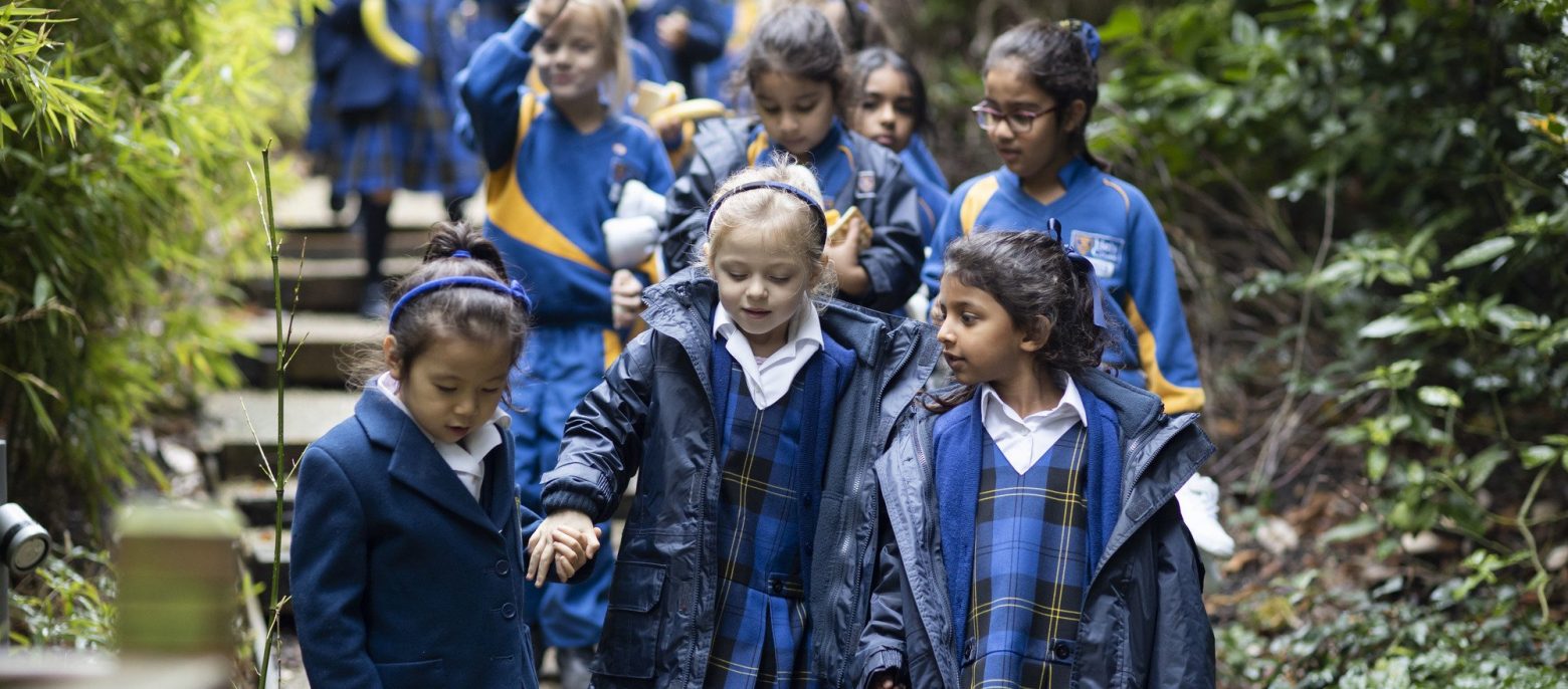 students on a walk with their coats on