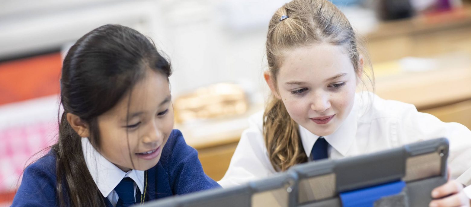 students using iPads together