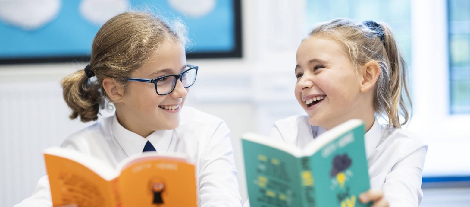 students reading books together