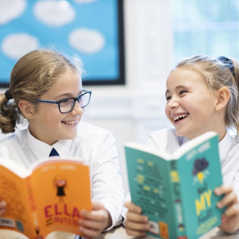 students reading books together