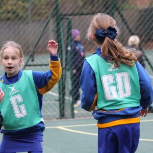 school girls playing netball