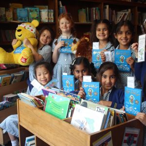 group of school girls holding books