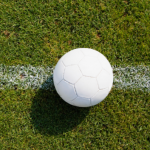 White football on grass pitch