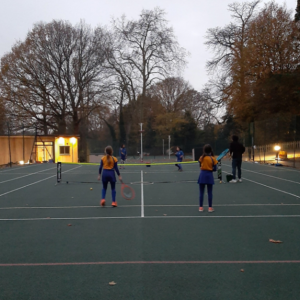 4 girls playing tennis