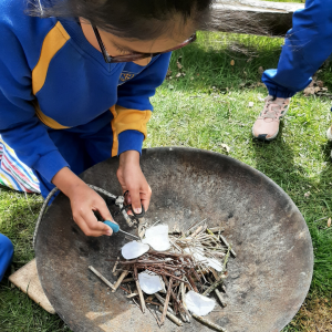 Children lighting a fire