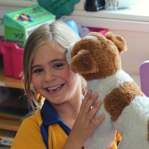 a student with a dog toy