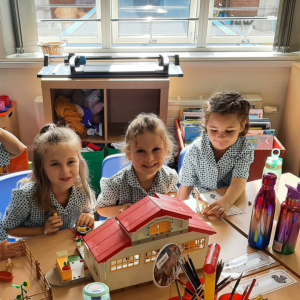 Children building a dollhouse