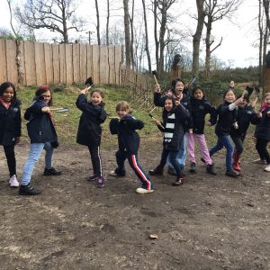 girls throwing axes