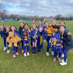 girls standing with their awards