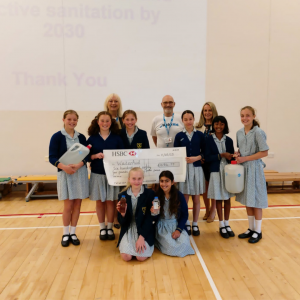 pupils holding a large cheque