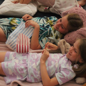 girls lying down with their teddies