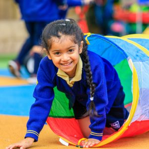 girl coming out of a spiral tube