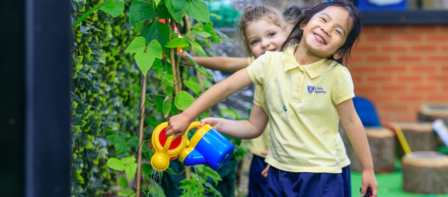 girls with watering cans