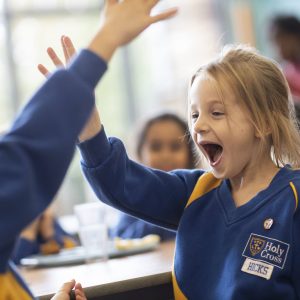 students smiling at each other