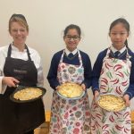 children showing off their completed pancakes